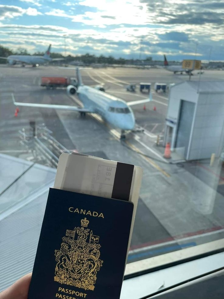 Travel documents and a Canadian passport in an airport setting